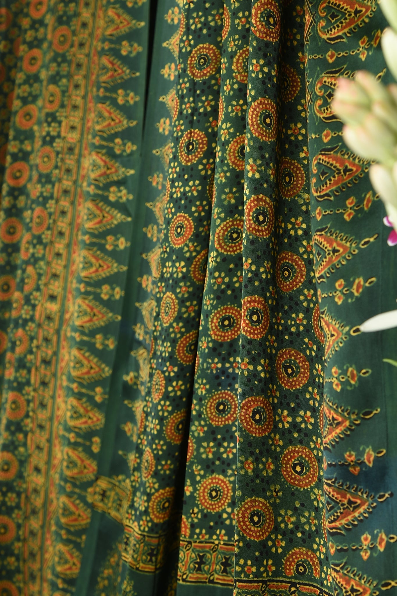 ajrakh modal silk sarees - glistening emerald & gold symphony